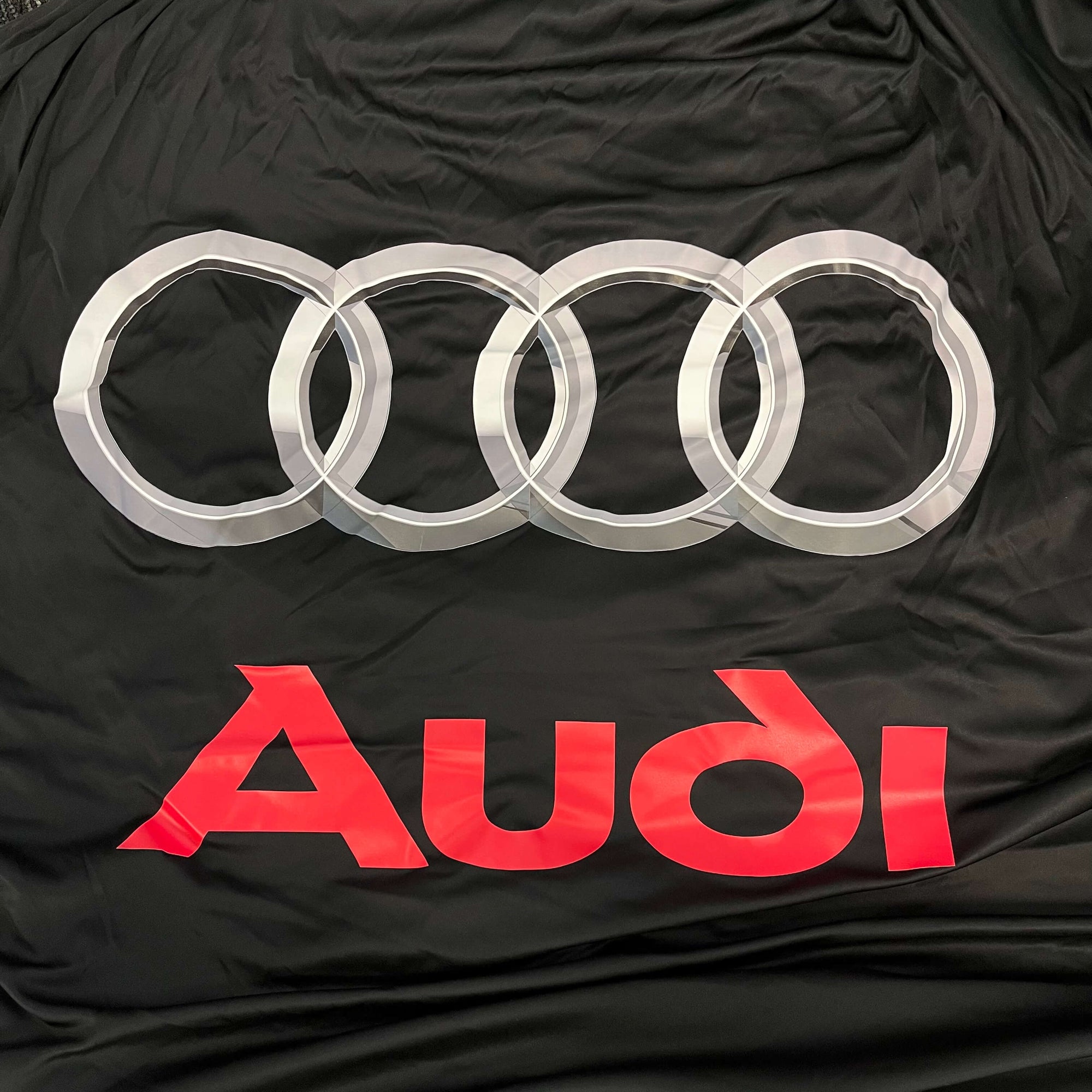 'Love Me Again' Showroom Reveal Cover - Audi Logo